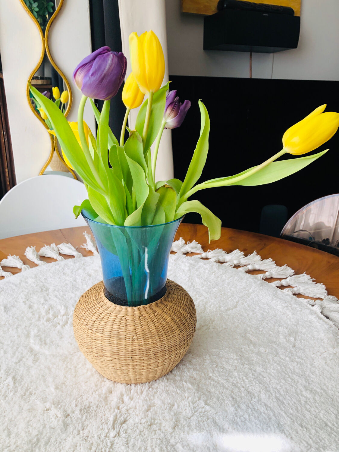 Blue blown glass vase and basketry