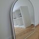 Arch mirror in white tubular steel frame from the 80s