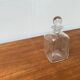 Vintage Danish glass bottle with engraving.