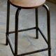 Old workshop stool in steel and beech