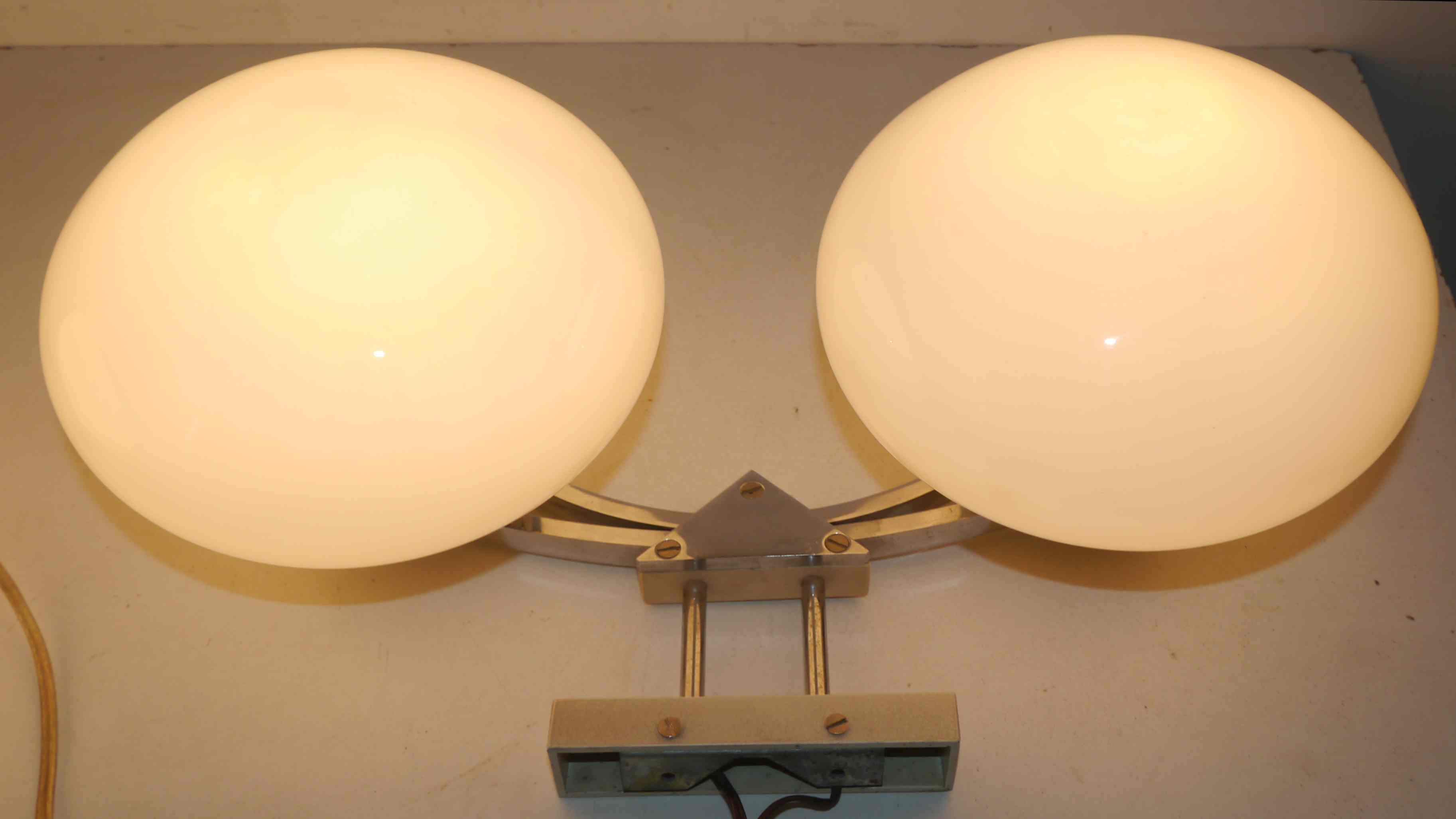Pair of 60s wall lights in metal and opaline