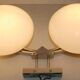 Pair of 60s wall lights in metal and opaline