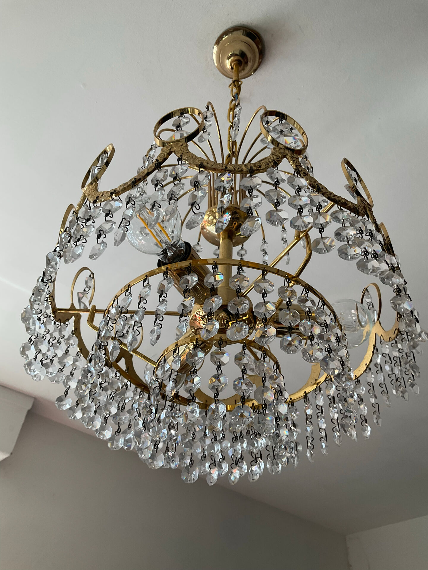 Brass chandelier with crystal pendants from the 1970s.