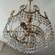 Brass chandelier with crystal pendants from the 1970s.