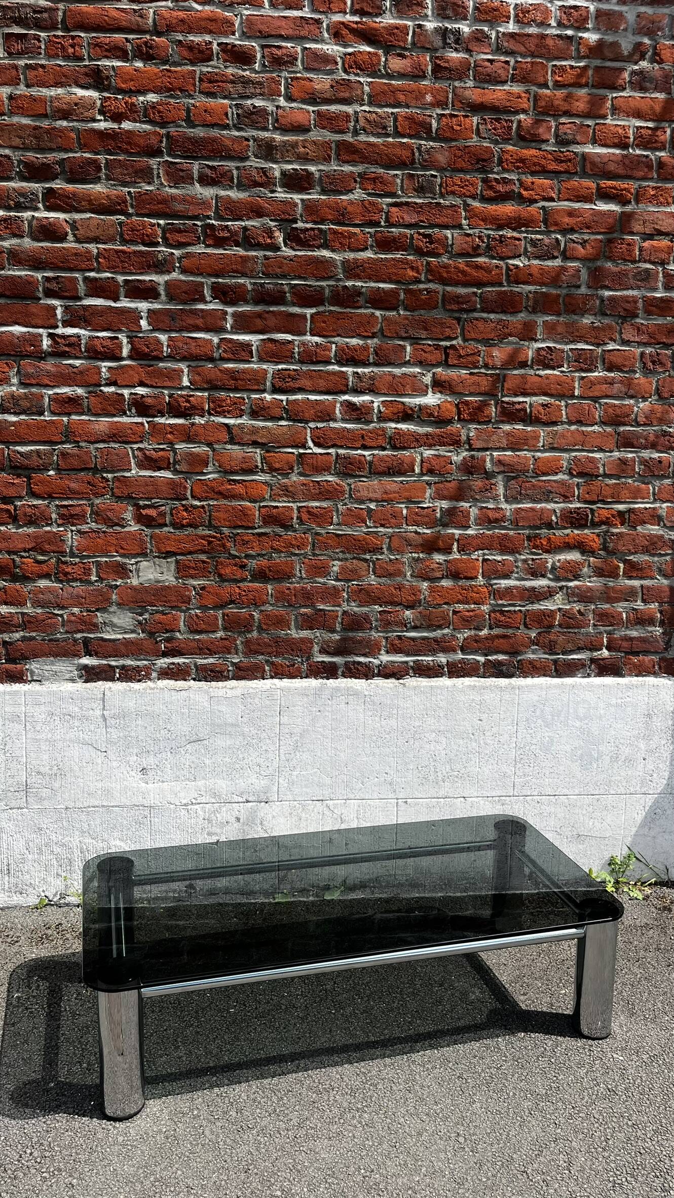 Vintage coffee table with smoked glass and chrome.