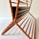 Wire metal magazine rack with triangular compartment, 1950s.