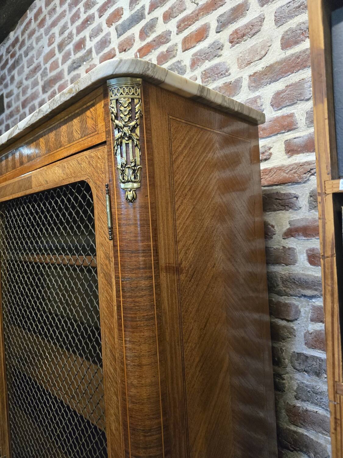 Marquetry bookcase with marble top