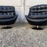 Paire de fauteuils vintage pivotants en cuir noir pied tulipe