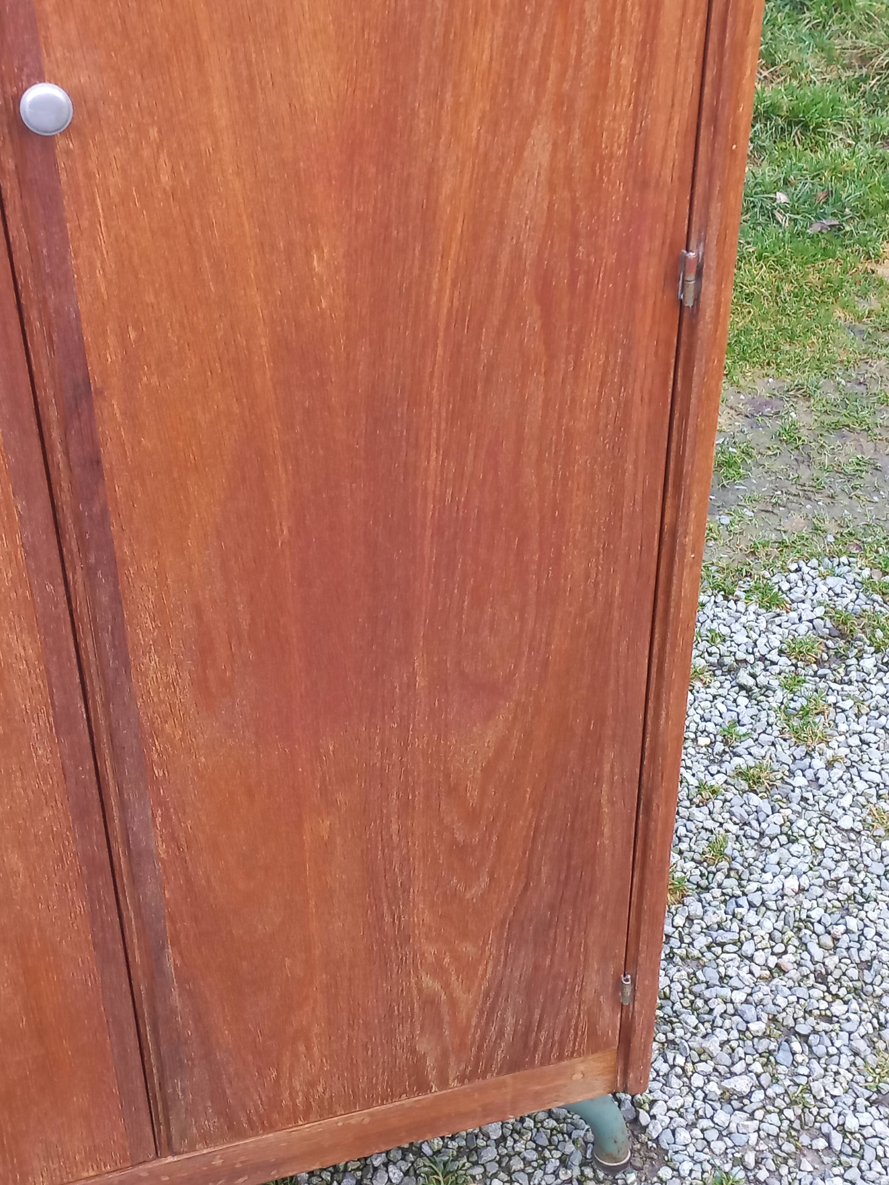 Vintage oak wardrobe with metal legs from the 1950s.