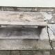Small country bench in grey pine, rustic antique style with storage shelf.