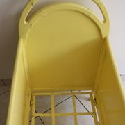 Yellow vintage baby cot