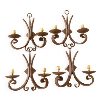 Four antique wrought iron wall lights