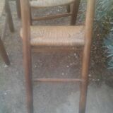 Set of five straw church chairs