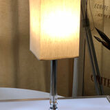Silver floor lamp with a straight shade.