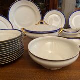 Limoges porcelain table service with blue band on white and gold background