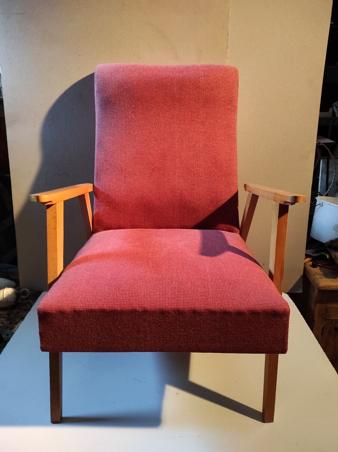 Vintage red armchair with compass feet in Scandinavian design