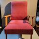 Vintage red armchair with compass feet in Scandinavian design
