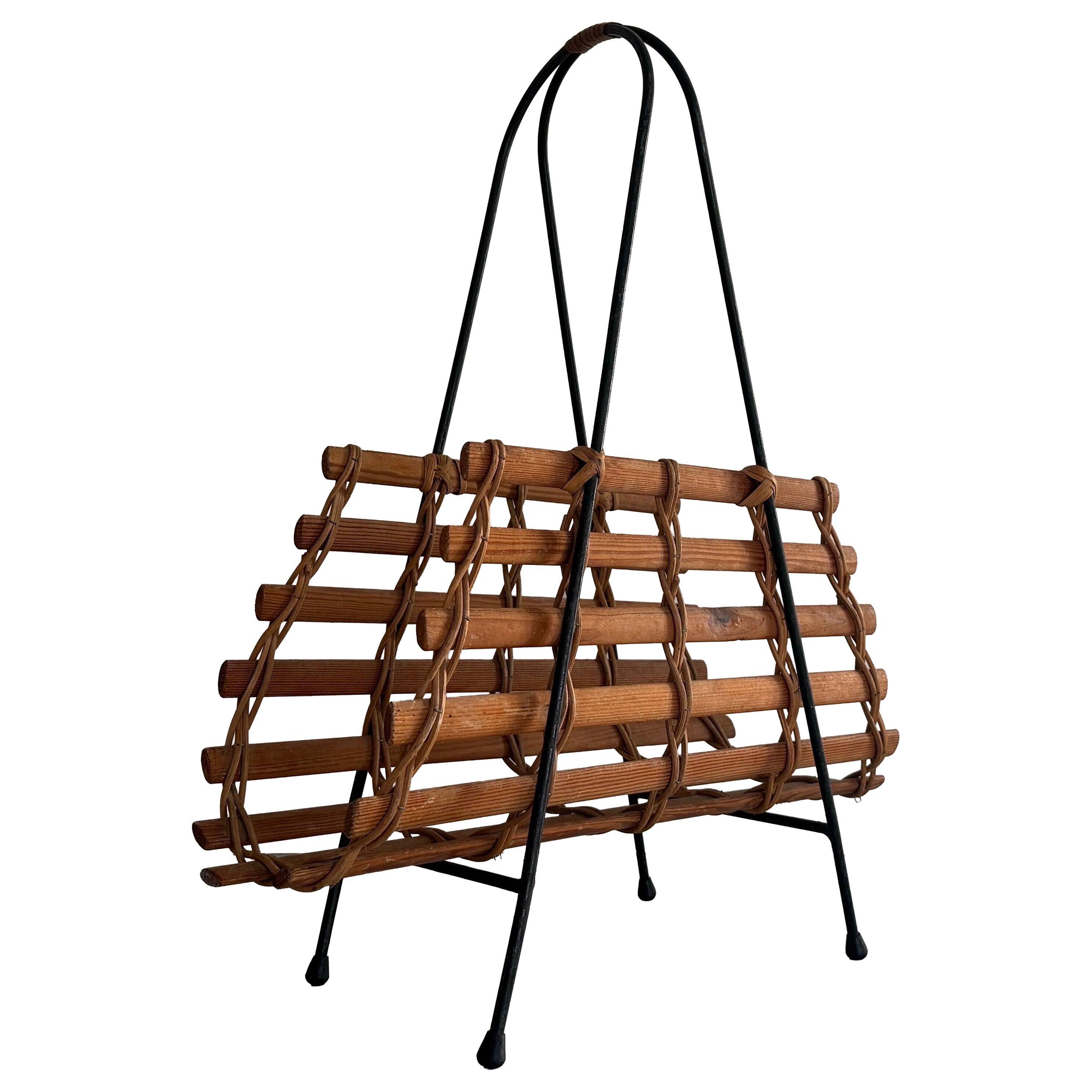 Mid-century black metal and wicker magazine rack, 1960, Germany