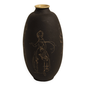 Ceramic vase decorated with women and a tree.