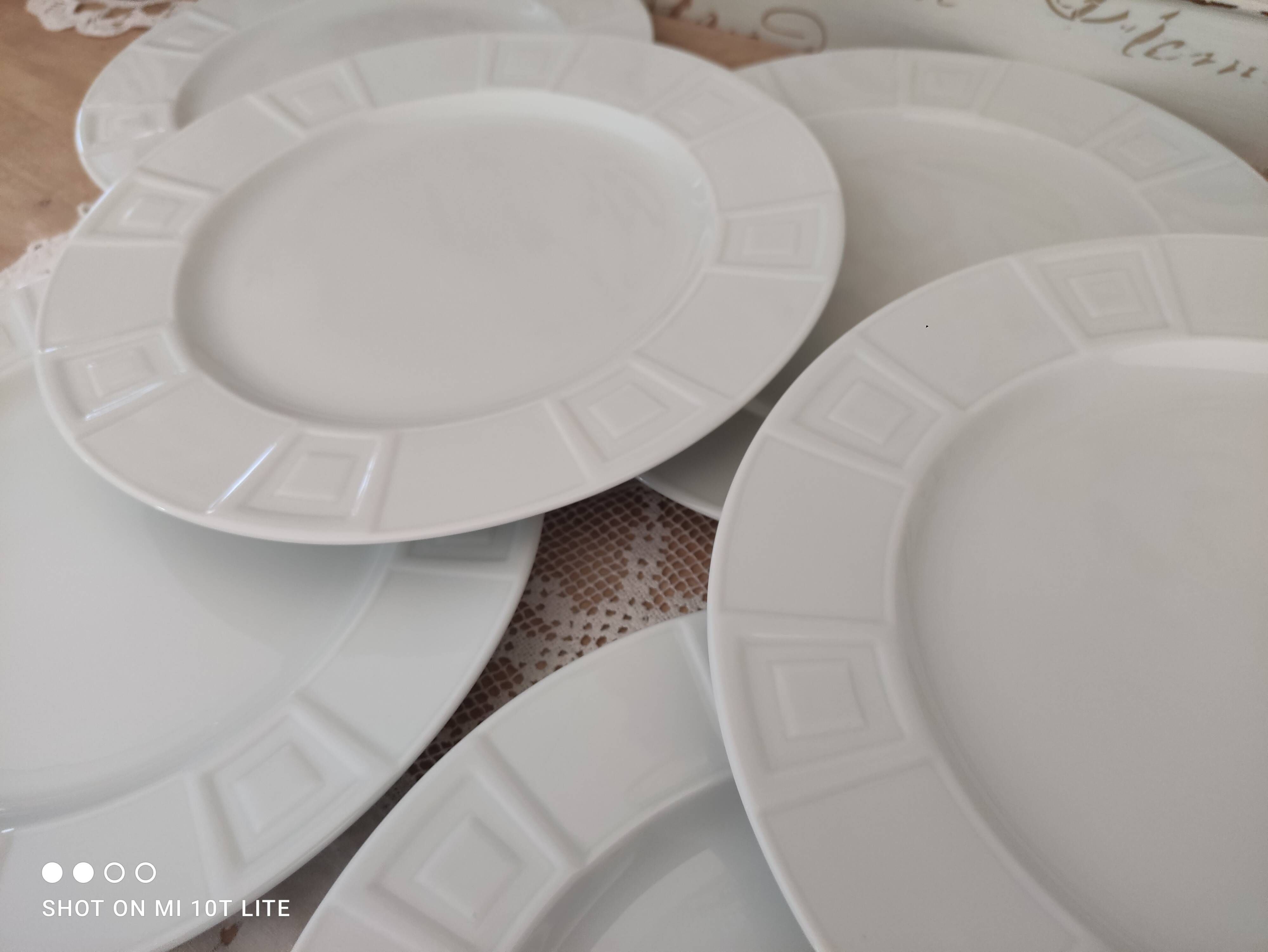 Set of 7 flat plates in white Limoges porcelain geometric decoration in relief