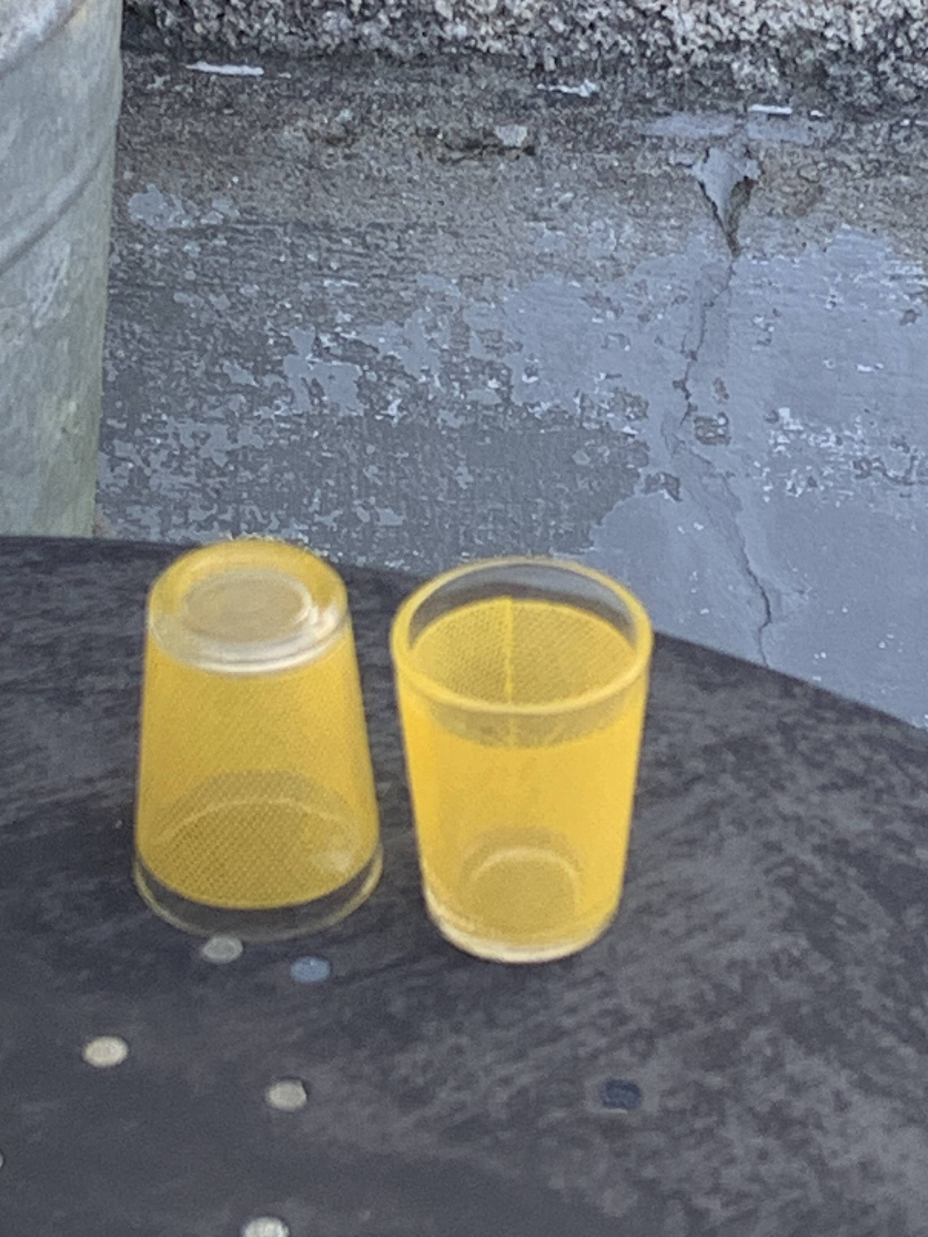 Liqueur service composed of a glass carafe and 8 small yellow screen-printed glasses