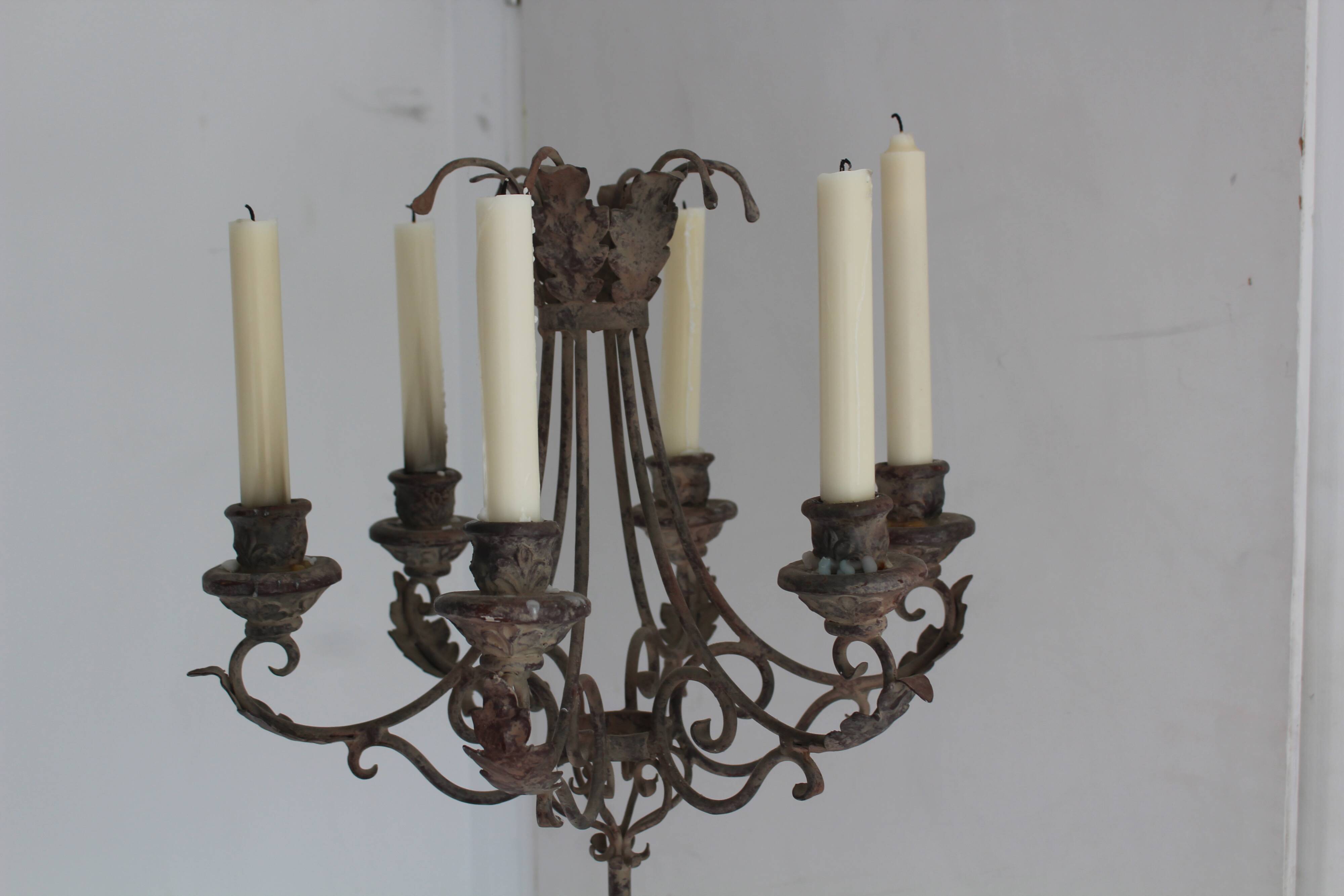 Candles on feet,  candelabras