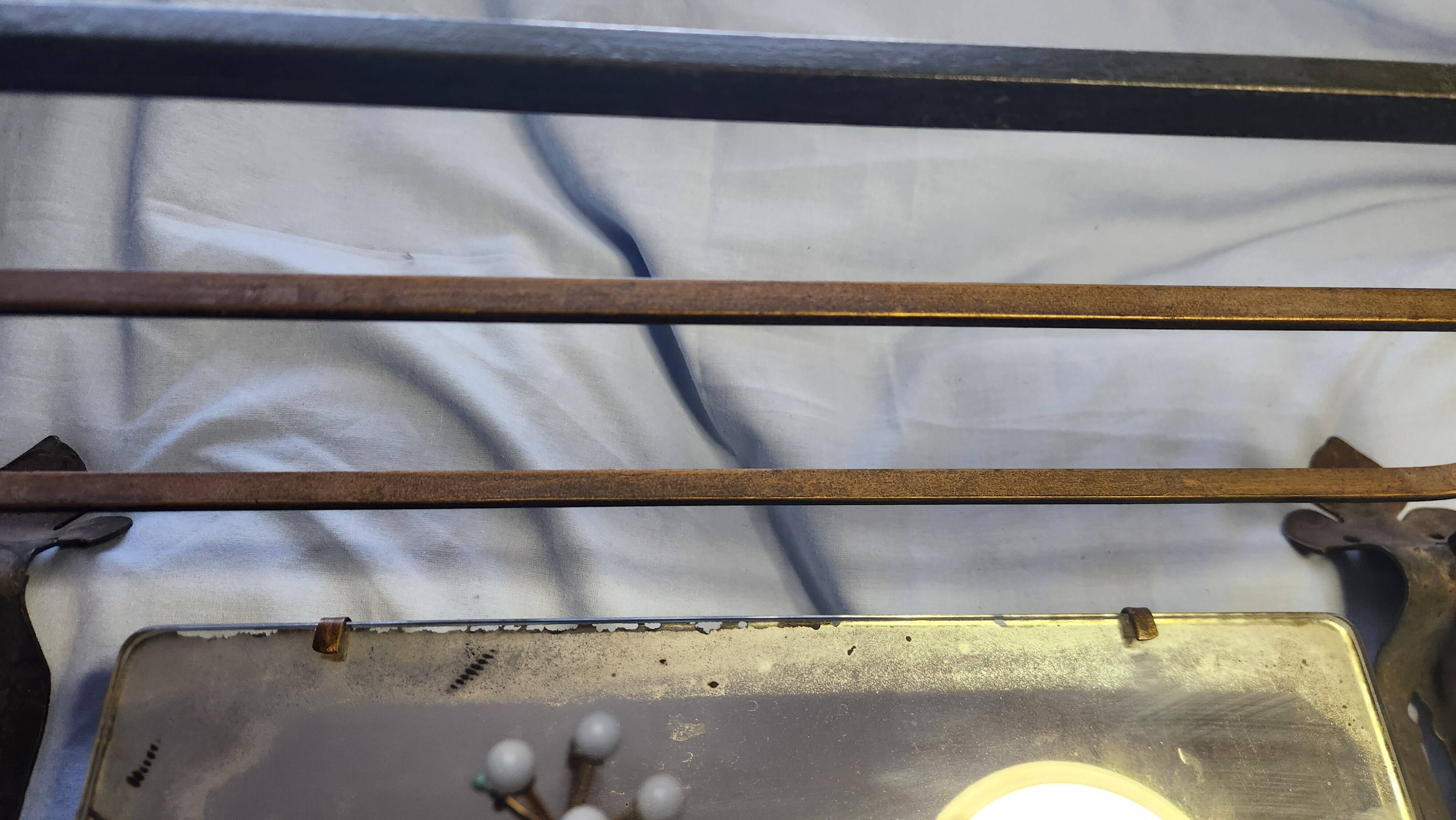 Vintage Art Deco wall-mounted coat and hat rack.