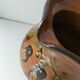 Glazed earthenware pitcher signed HR with a design of stylised birds.