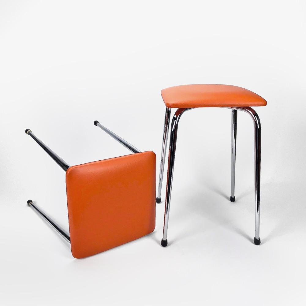 Duo of stools in orange skai and stainless feet