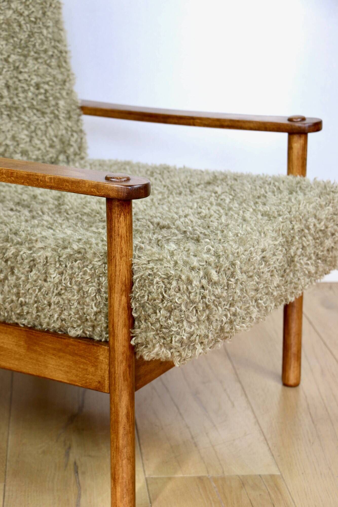 Wooden vintage brown armchair, olive green, long pile on removable cushions