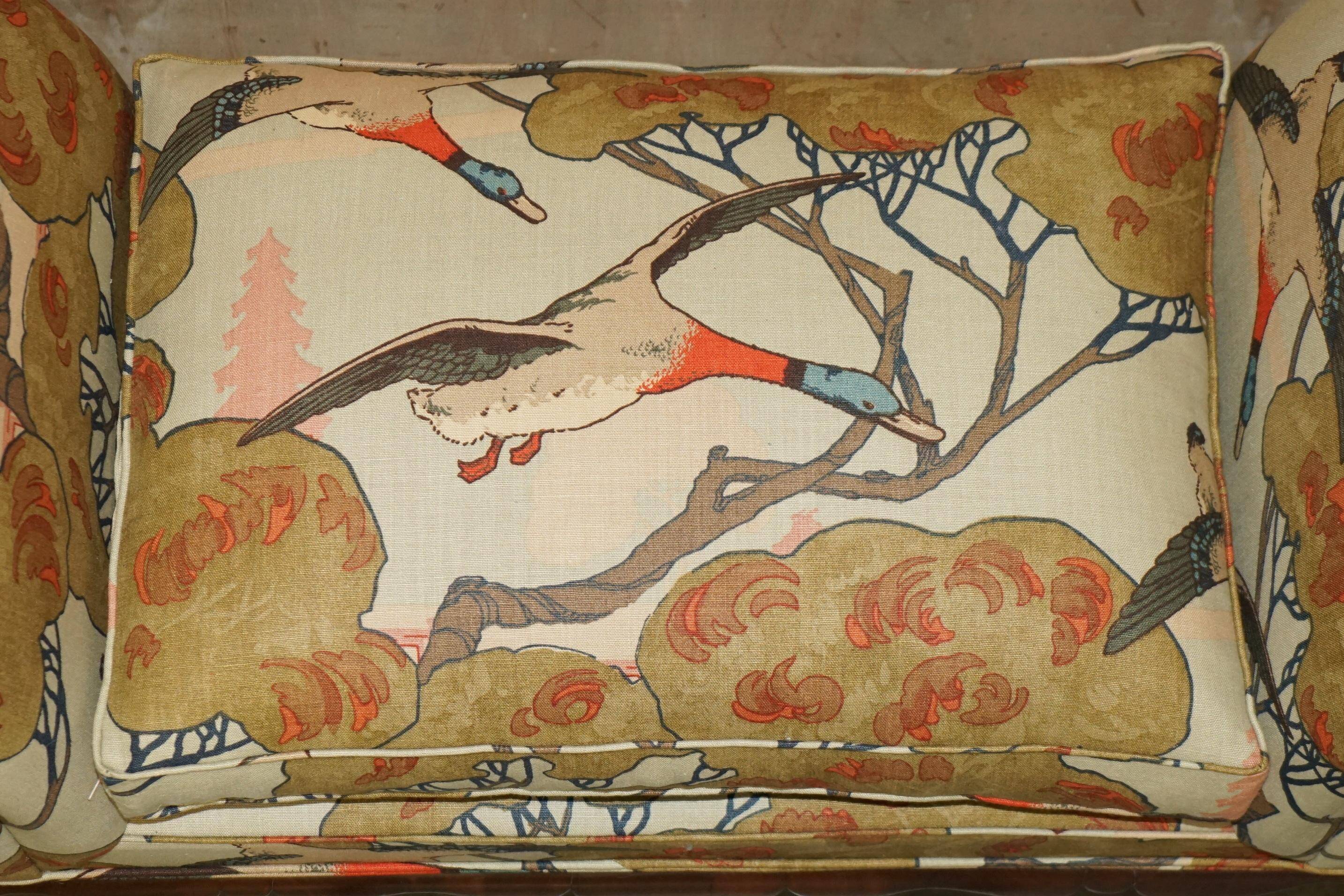 Antique banquette with cluster and ball feet, window seat in Mulberry Flying Ducks fabric.
