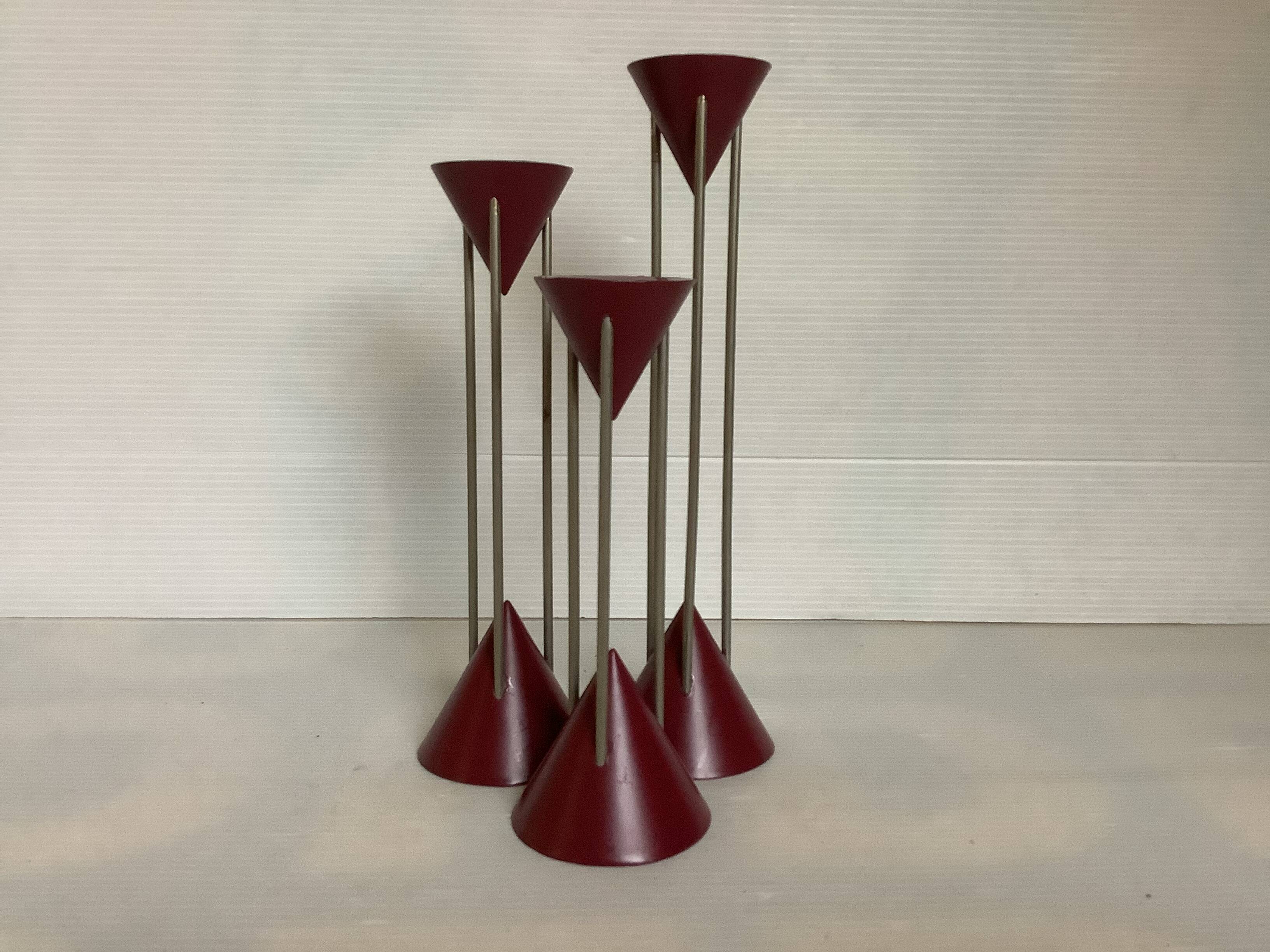 Trio of vintage burgundy candlesticks