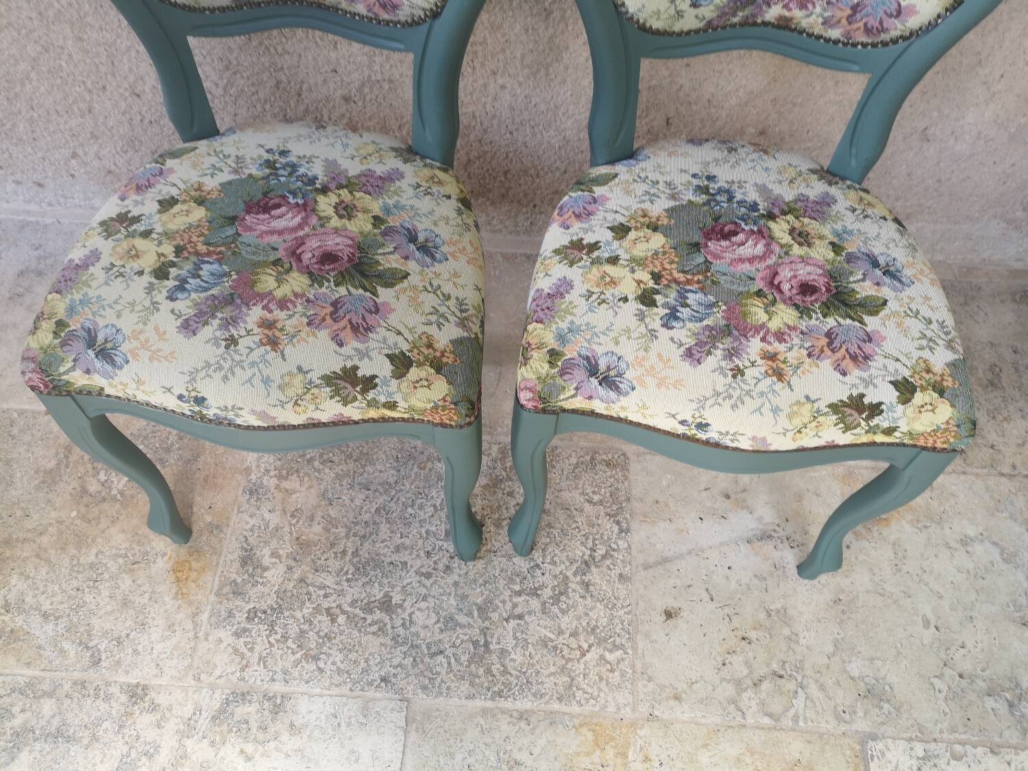 Antique chairs with studded upholstery.