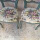 Antique chairs with studded upholstery.