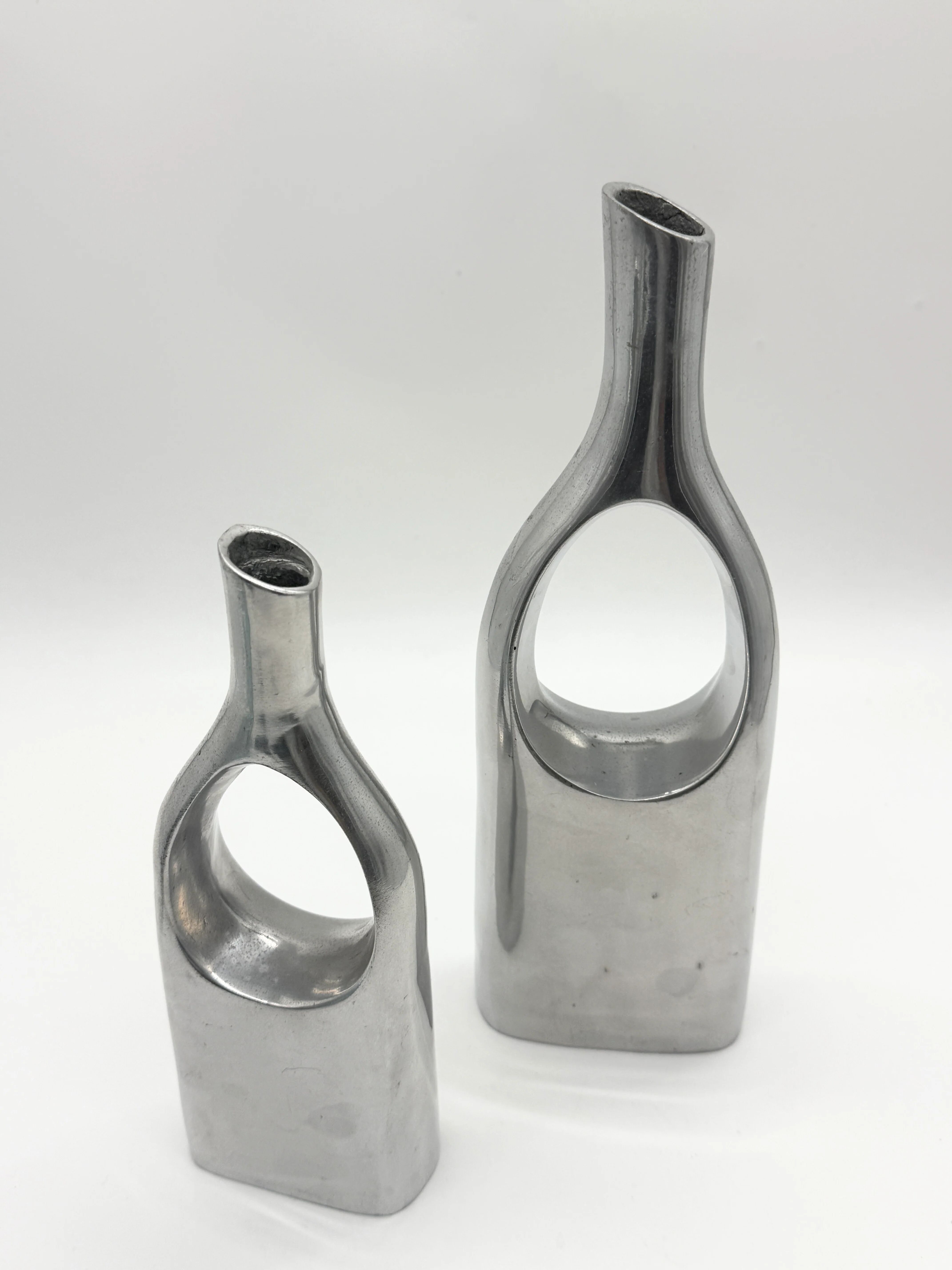 Pair of "drop" vases in aluminium cast, Italy, 1970s