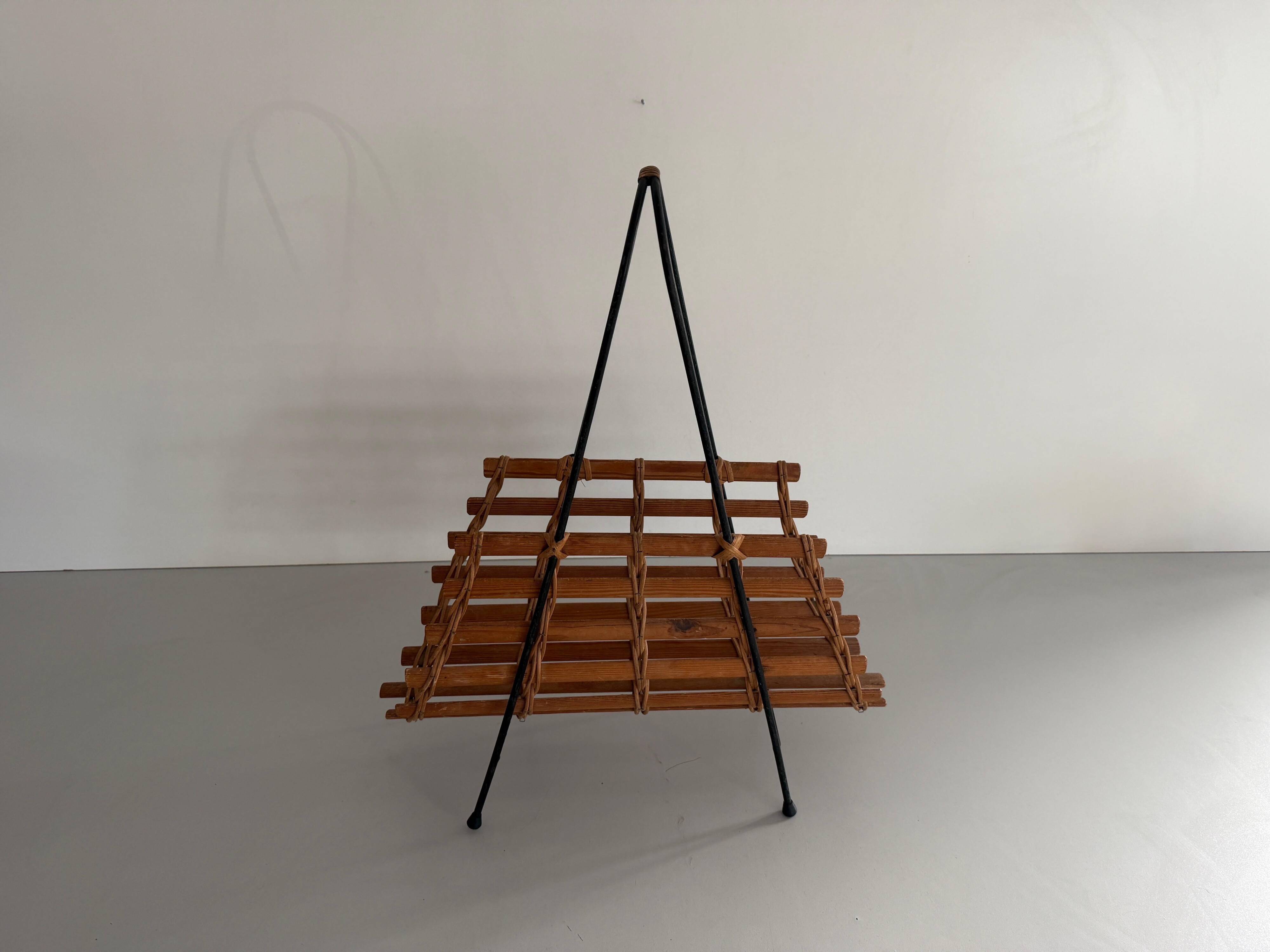 Mid-century black metal and wicker magazine rack, 1960, Germany