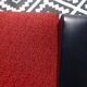 Vintage armchairs in red and black faux leather, the pair.