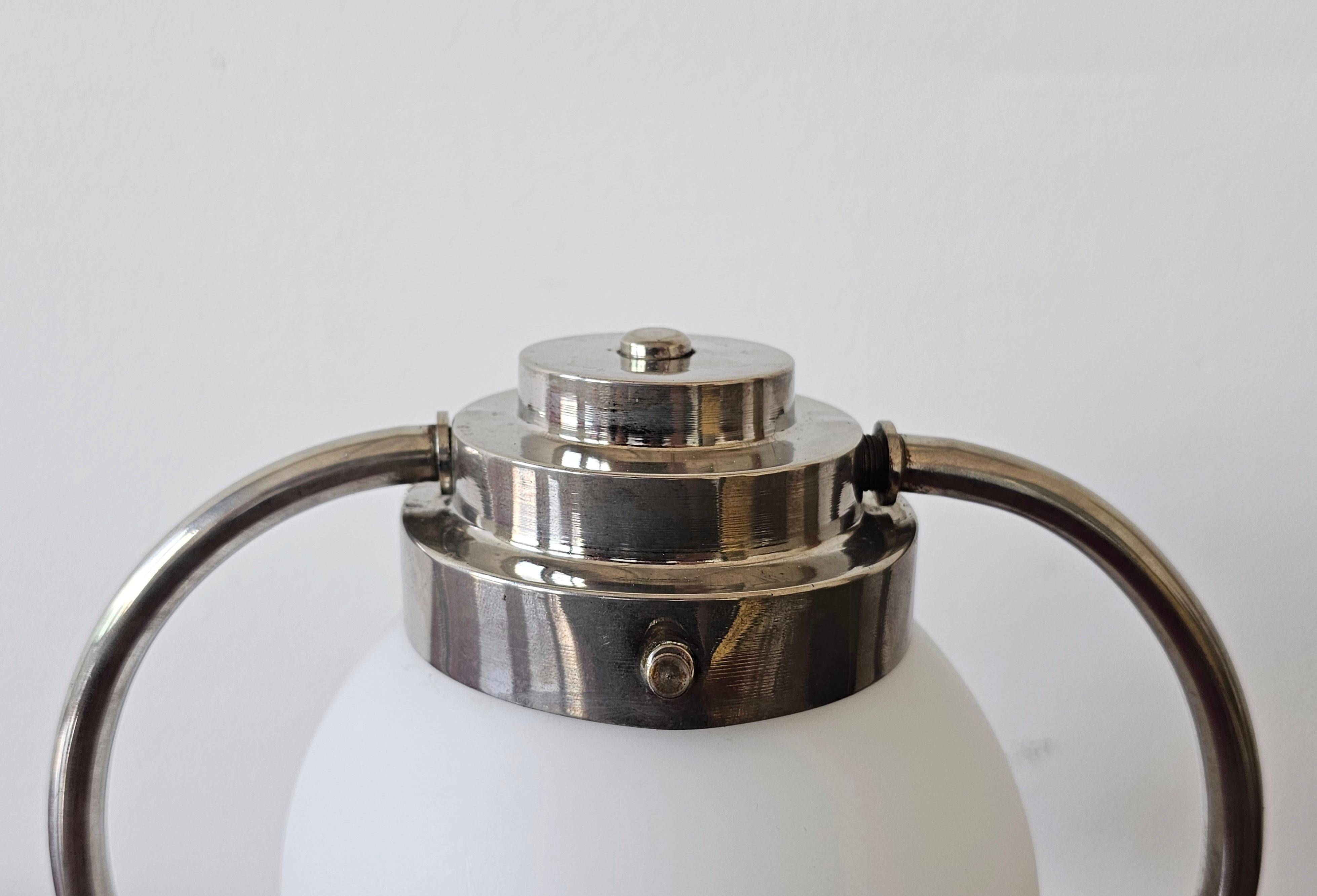 Art Deco table lamp with a spherical opaline glass shade and chrome base from the 1930s.