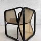 Cubic armchair in black rattan and canework