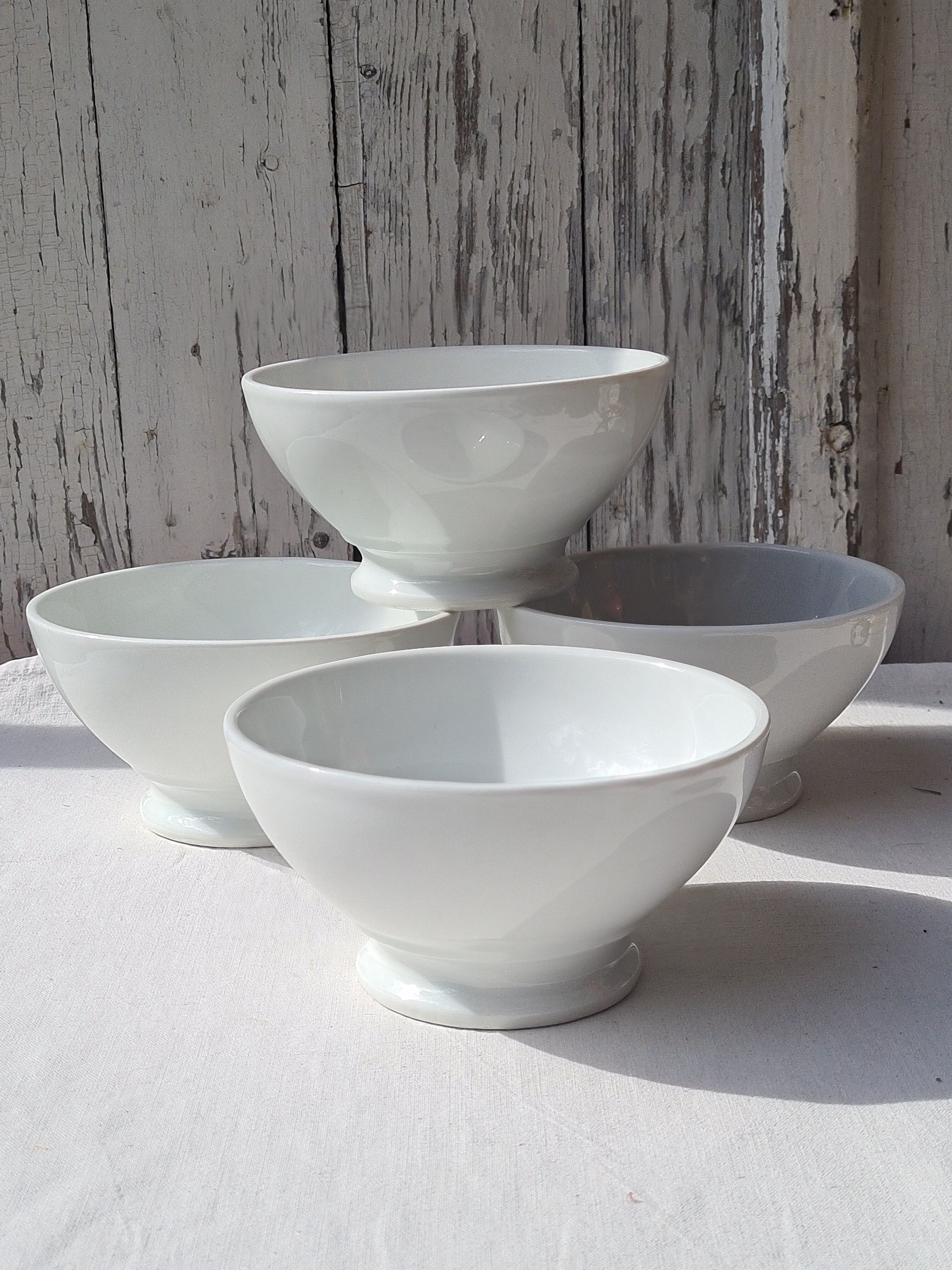 Four bowls made of thick white porcelain