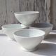 Four bowls made of thick white porcelain