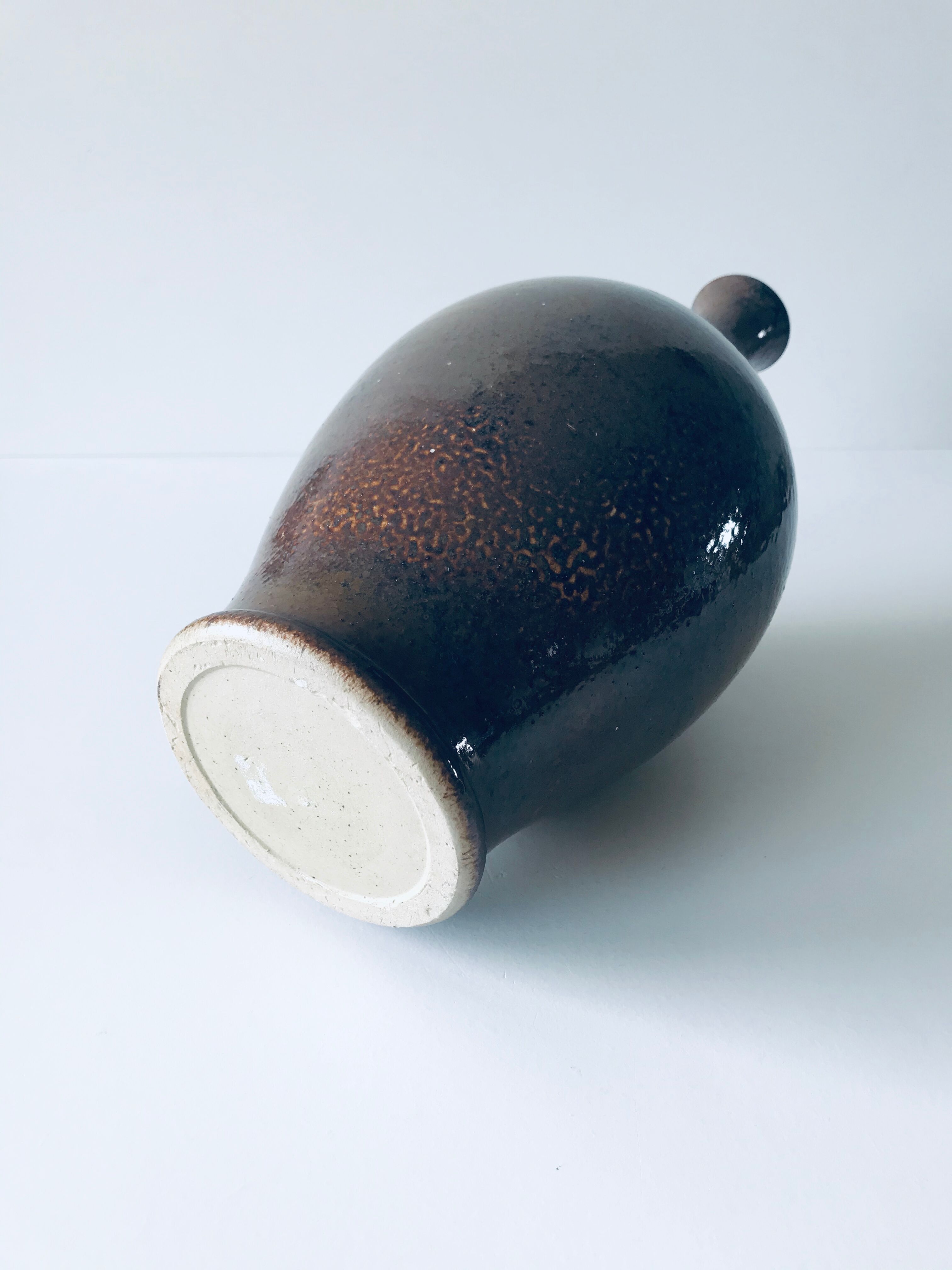 Enamelled sandstone vase