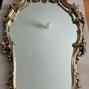 Rocaille style mirror from the 20th century in wood and gilded stucco, Putto on the pediment