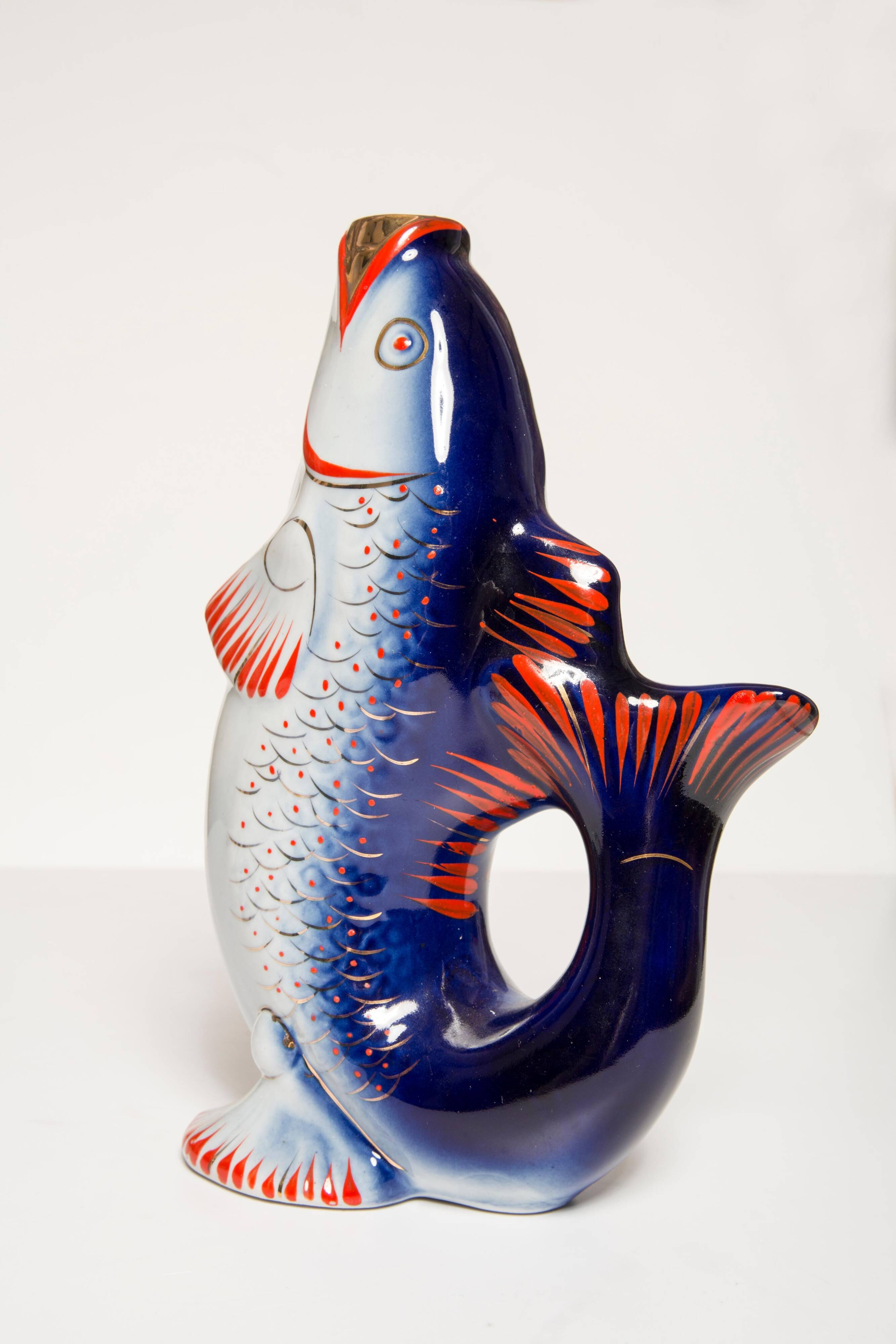 Set of 7 glasses and a glass carafe decorated with blue fish, Mid-Century Modern style, Europe, 1960s.