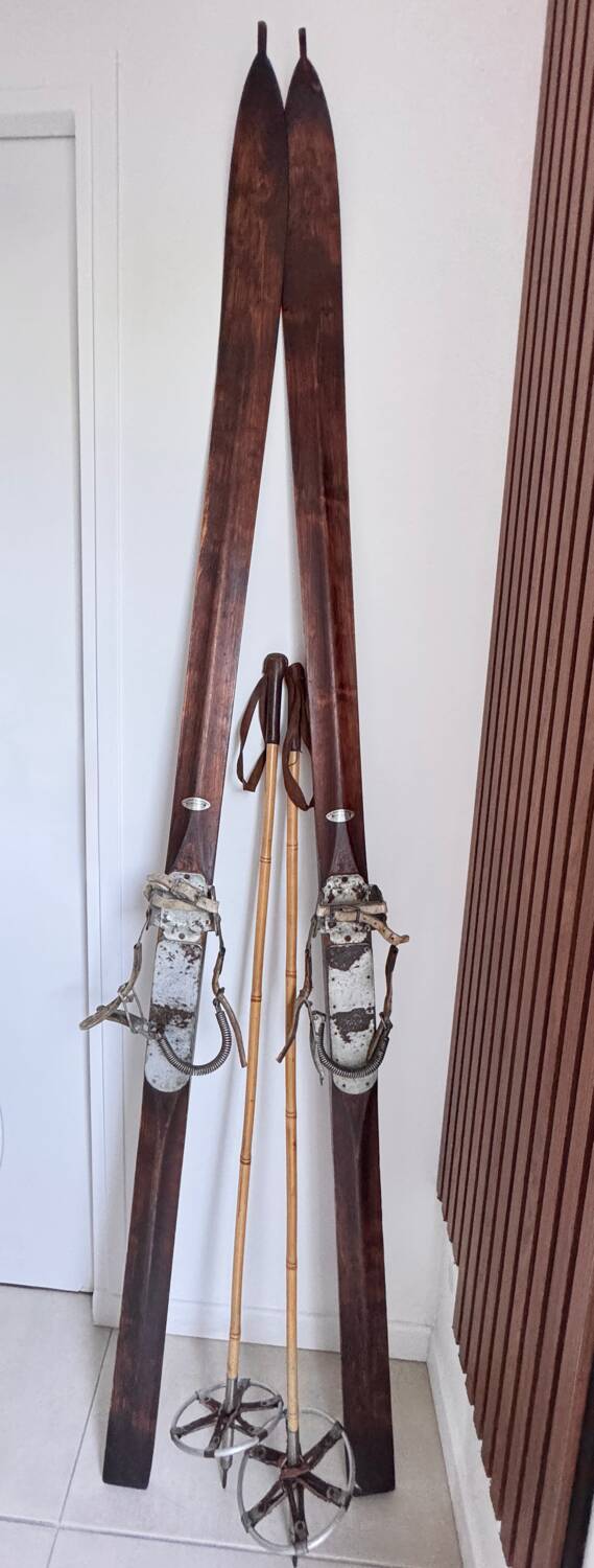 Antique wooden skis with vintage poles