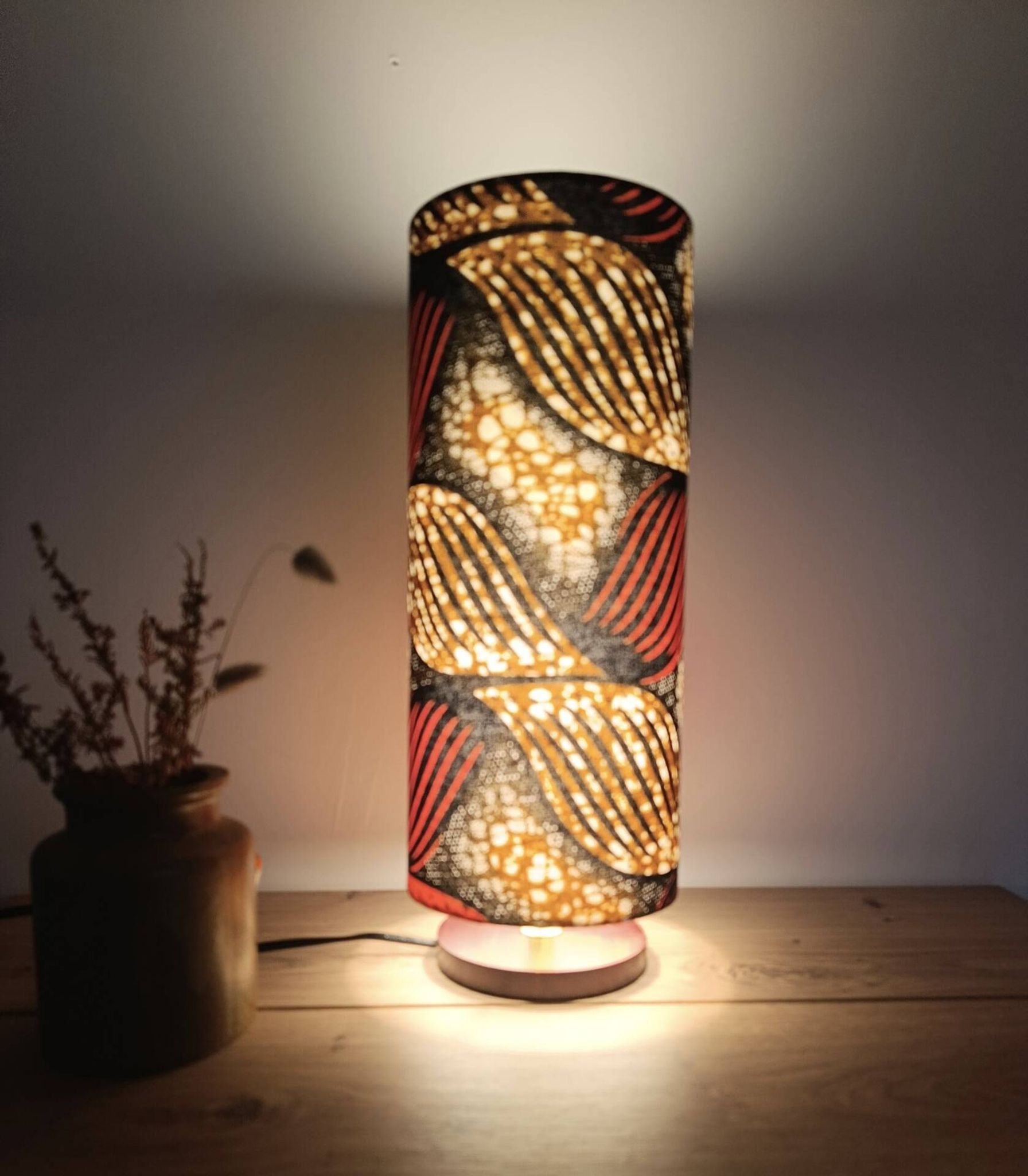Tube lamp with wooden base and wax boho-ethnic fabric