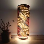 Tube lamp with wooden base and wax boho-ethnic fabric