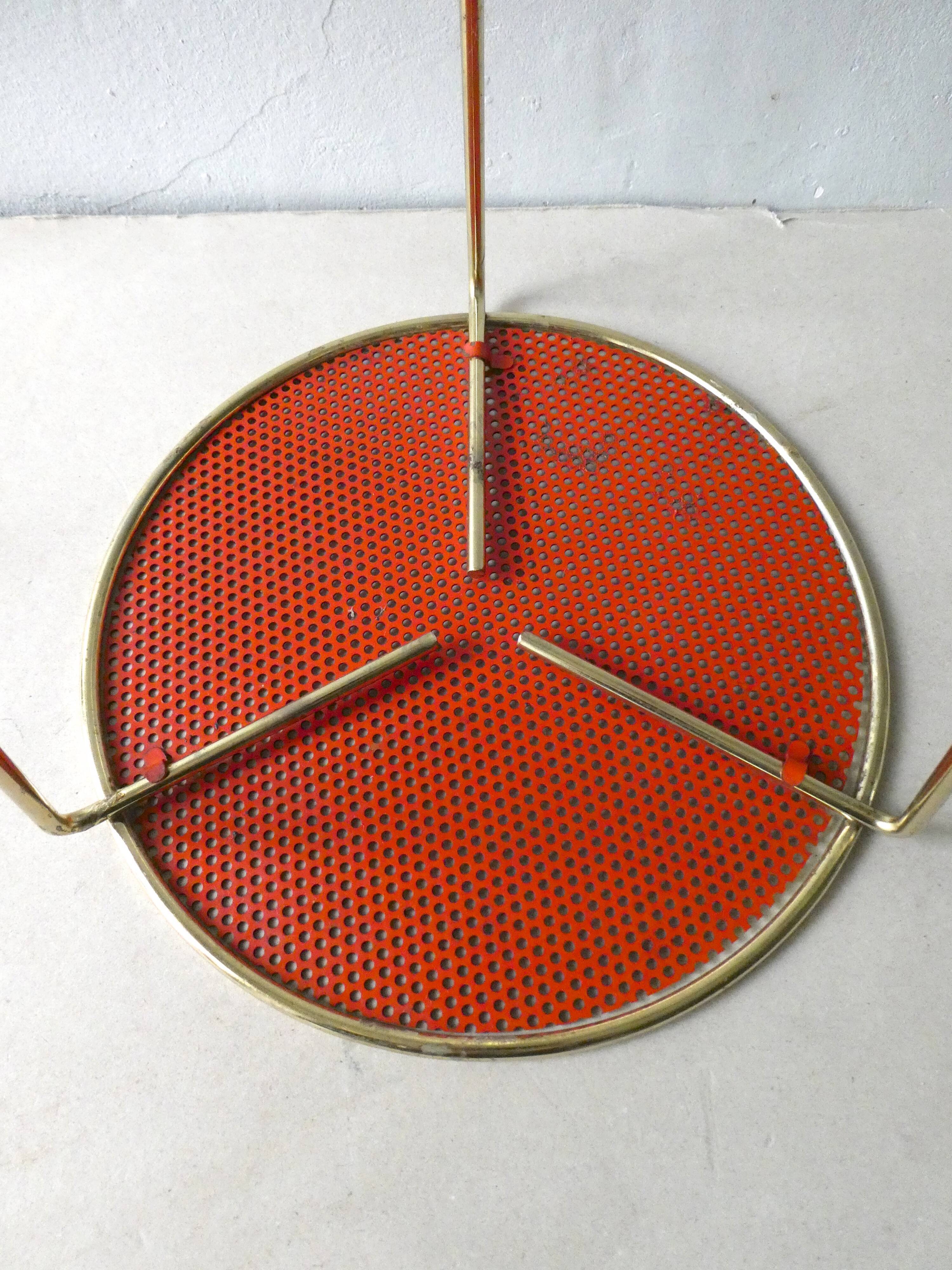 Tripod healing in gold metal and perforated metal from the 1960s