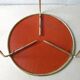 Tripod healing in gold metal and perforated metal from the 1960s