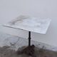 Bistro pedestal table in marble and cast iron lion paws
